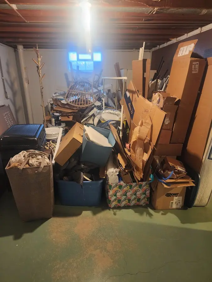 Roll-off dumpster container at job site for 2 Yard Dumpster Rental in Genesee